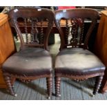 A pair of Victorian pierced mahogany dining chairs