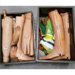 A large collection of wooden shoe trees, many with