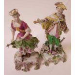 A pair of 18th century porcelain figures of a she
