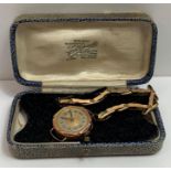 A lady’s 9 carat gold mechanical wrist watch, on a