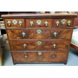 An early 19th century walnut chest of drawers, wit