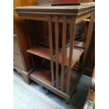 A 20th century mahogany revolving table top bookca