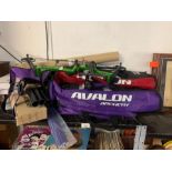 Shelf of Archery equipment including recurve bows,