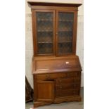 Large bureau with glazed top, condition requests a