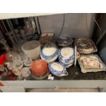 Shelf of tureens, plates, decanters, cut glass etc