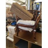 2 cane/wicker chairs with cushions, along with a w