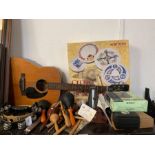 Shelf of musical instruments to include a guitar,