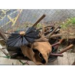 Metal wheelbarrow containing vintage hand tools, c