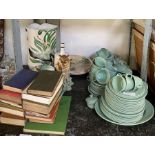 Shelf to include books, ornamental plates, green d