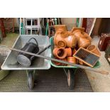 2 wheelbarrows, metal coal scuttle, watering cans