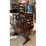 Dark wood drop leaf dining table with 4 chairs, co
