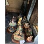 Half shelf of animal ornaments on wooden bases & s