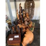 Half shelf of wooden animal sculptures, boxes, can