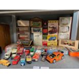 Shelf of some boxed Days Gone by vehicles and some