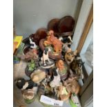 Collection of mostly dog ornaments on wooden bases