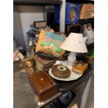 Half shelf of art books, table lamp, blue & white