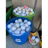 2 plastic buckets of golf balls & some golf tees,