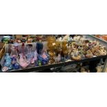 Shelf of glass vases, paperweights, glasses, anima