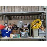 Shelf of mainly hand tools, barbed wire, air compr