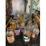 Half shelf of Unigate milk bottles, condition requ