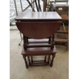 Nest of 3 tables along with a dark wood drop leaf