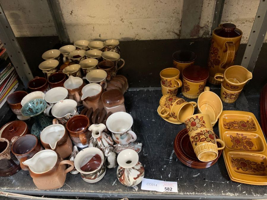 Shelf of Studio Pottery mugs, jugs & collection of
