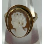 A cameo ring, the brown and white shell carved as
