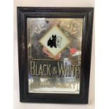 An advertising mirror for "Black and White, Scotch