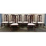 A set of eight oak dining chairs, each with drop i