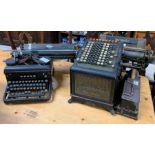 A Royal Typewriter, along with a Burroughs adding