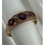 A 19th/20th century ring set with three garnets an
