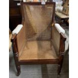 A 19th century mahogany Bergere library chair, hav