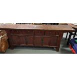 A 20th century Chinese elm altar table, set with f