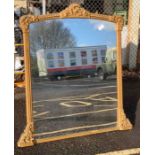 A gilt framed over mantel mirror, with each side h