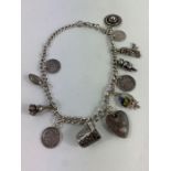 A silver Albert chain with various charms attached