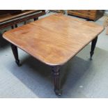 A Victorian mahogany extending dining table, stand