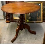 A 20th century mahogany tilt top table, standing