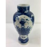 A 19th century Chinese blue and white baluster vas