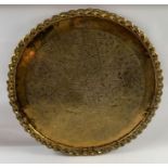 A large Indian brass circular engraved plaque, 94c