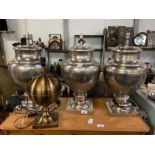 3 metal urn style table lamps along with one other