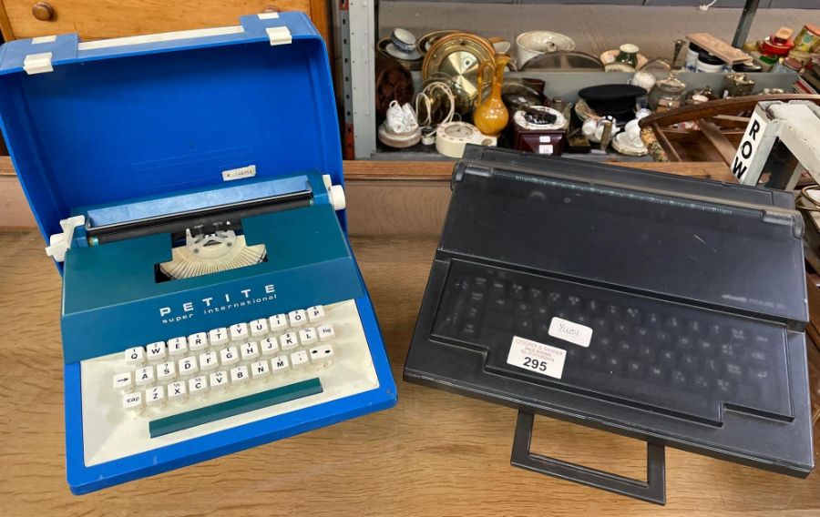 Petite Super International typewriter along with a