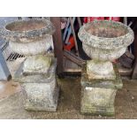 Pair of sandford stone weathered urns