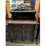 Ornately carved oak cupboard