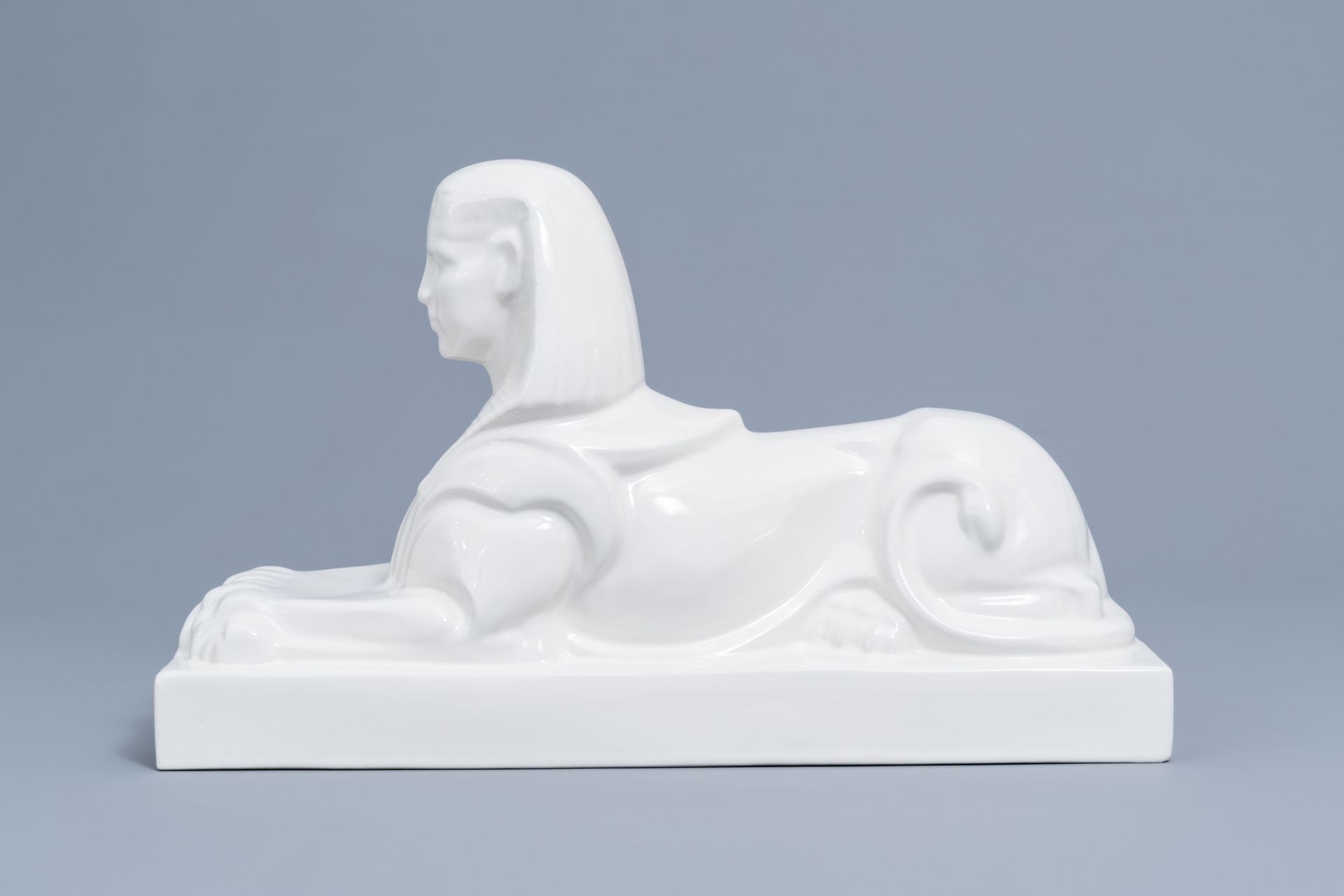 A large white glazed Maastricht earthenware figure of a sphinx, Petrus Regout, first half 20th C. - Image 4 of 8