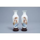 A pair of Chinese polychrome vases on wooden bases, Wan Yu mark, 20th C.