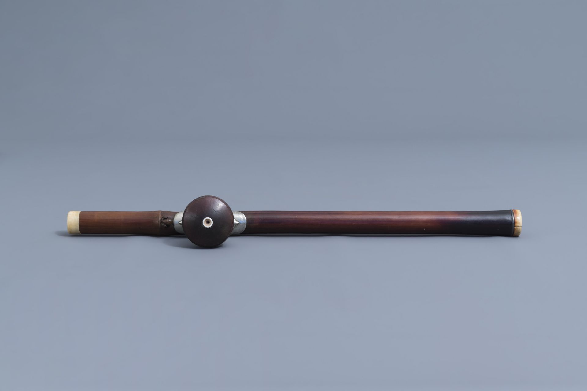 A Chinese bamboo opium pipe, an ivory mouth- and endpiece and a stoneware damper, 19th C. - Image 5 of 9