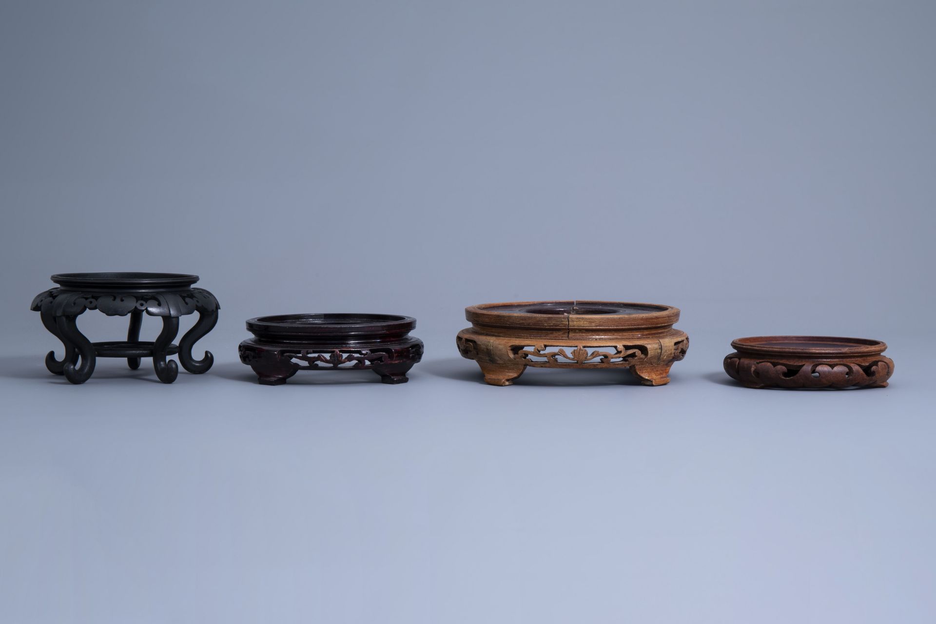 A collection of Chinese carved wooden stands, 19th/20th C. - Image 9 of 32