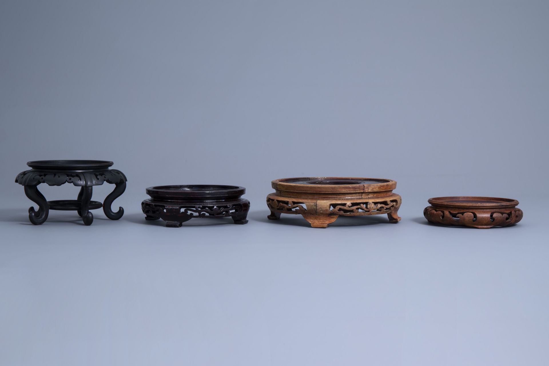 A collection of Chinese carved wooden stands, 19th/20th C. - Image 12 of 32