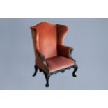 A finely carved English George III mahogany wing armchair, 18th C.