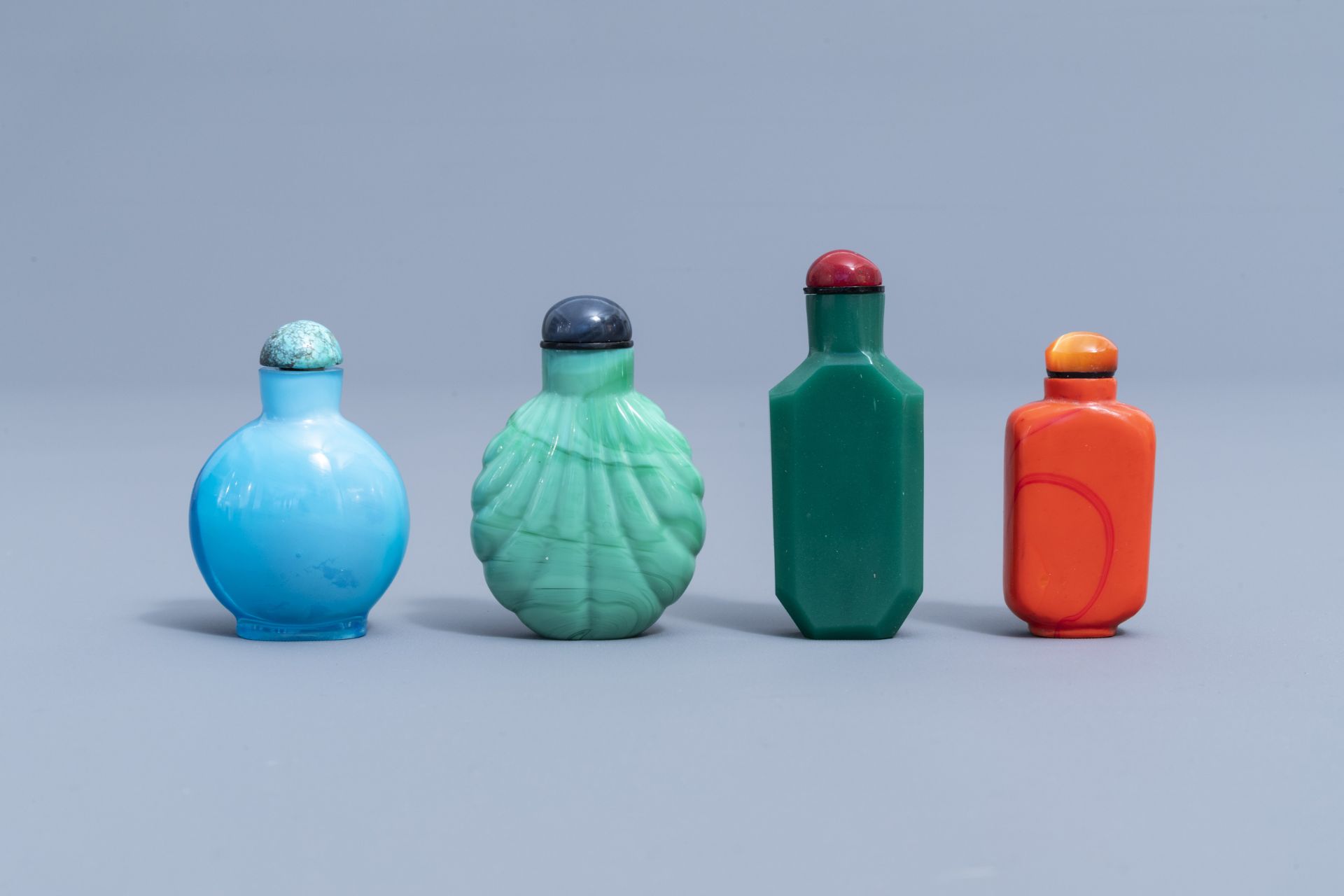 Seven Chinese monochrome glass snuff bottles and one in coconut, 20th C.